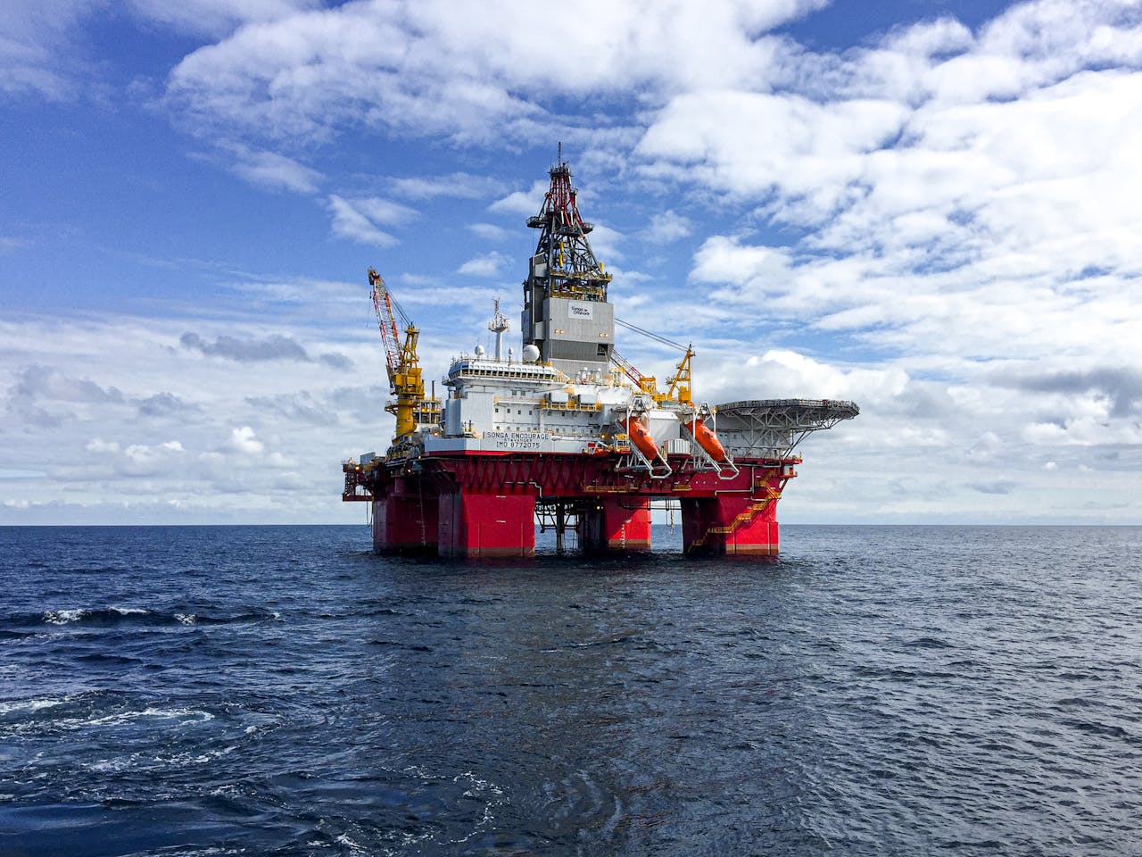 Majestic offshore oil platform under a bright sky in the North Sea, showcasing Norways energy infrastructure.